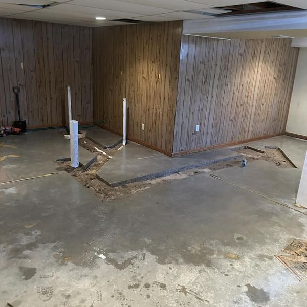 Basement bathroom rough-in with new drain lines by KW Plumbing
