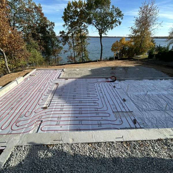Radiant in-floor heating loops on a lakefront new construction slab by KW Plumbing