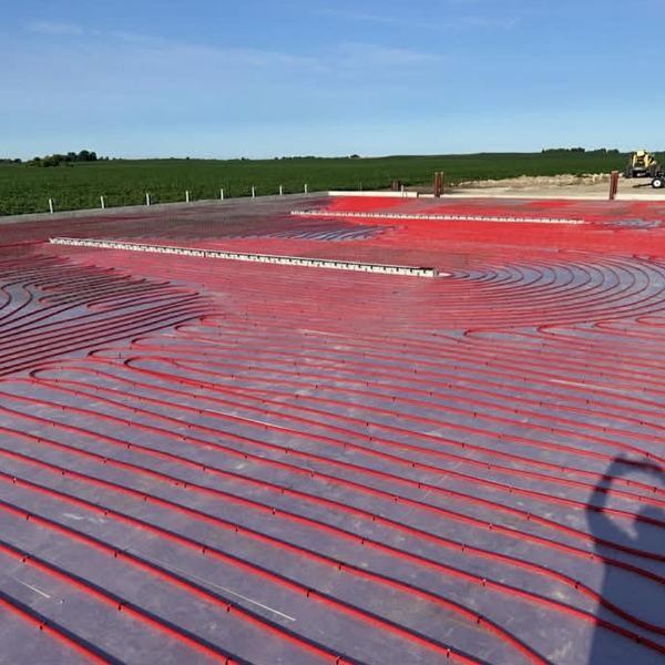 Radiant in-floor heating tubing laid before a concrete pour by KW Plumbing