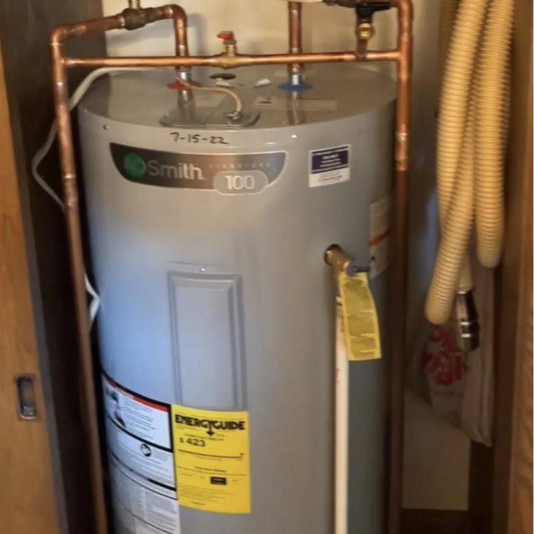 Electric tank water heater installed by KW Plumbing